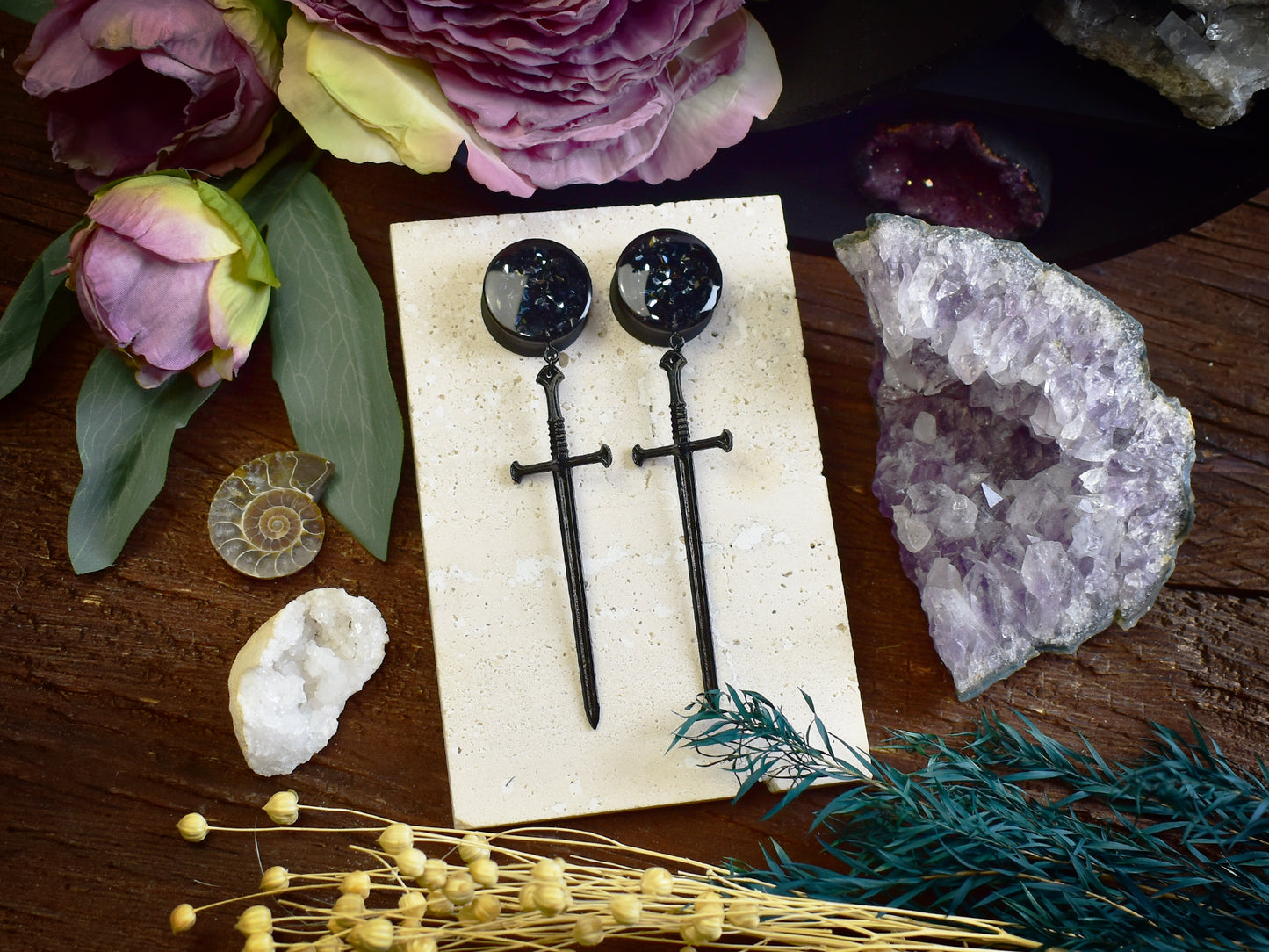 Handmade lightweight ear tunnels featuring black sword charm filled with black sparkling rhinestones