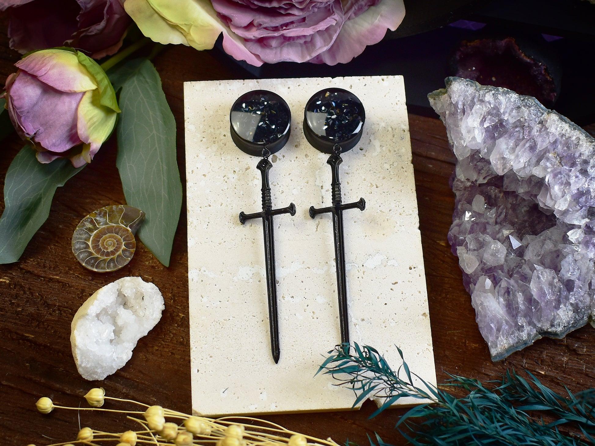 Lightweight ear tunnels with black sword pendant and black rhinestones, perfect for stretched ears