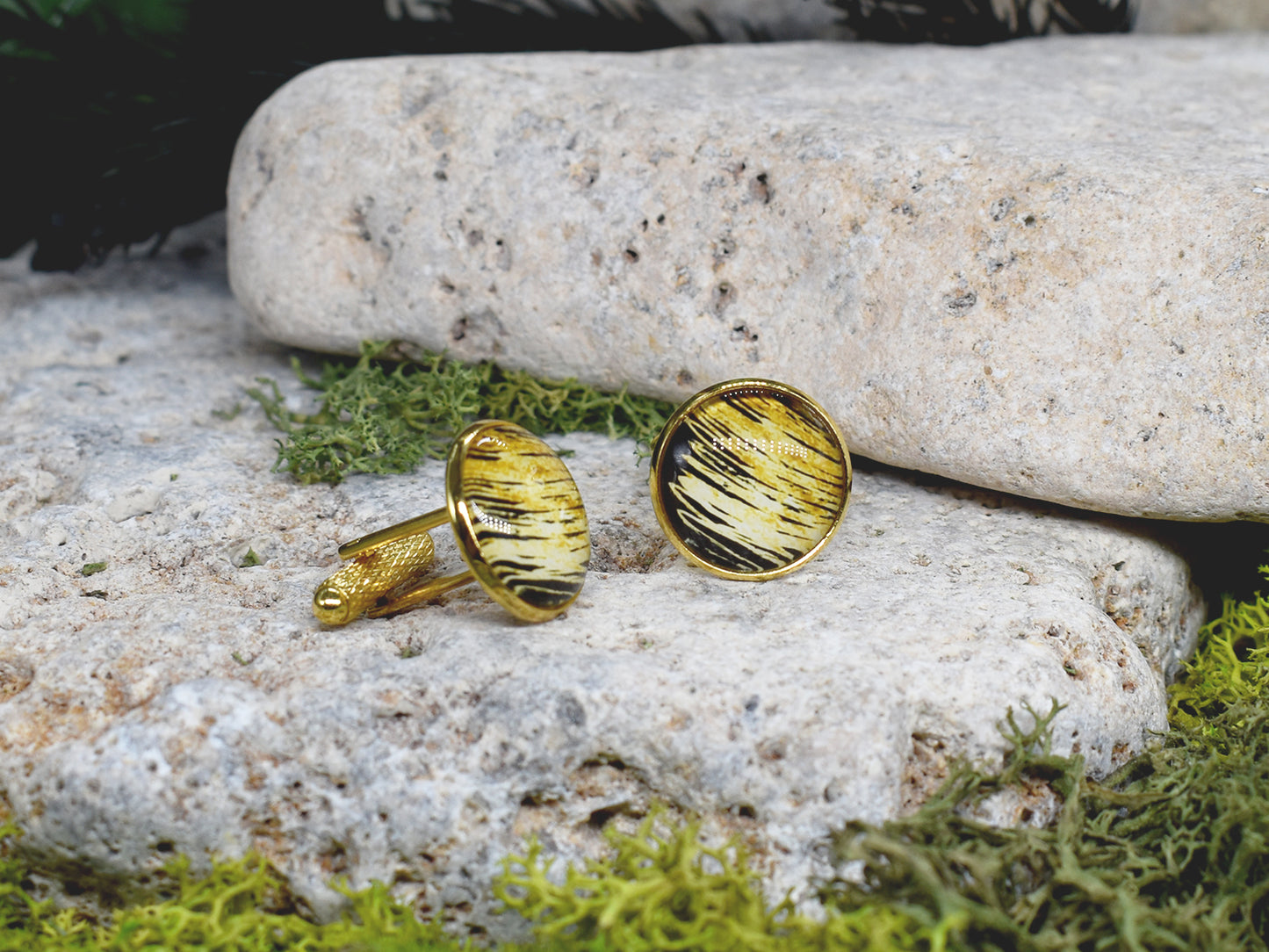 Gold cufflinks with black and gold cabochon