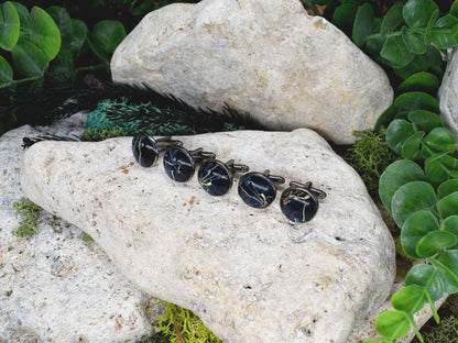 Gemelos negros con patrón de piedra