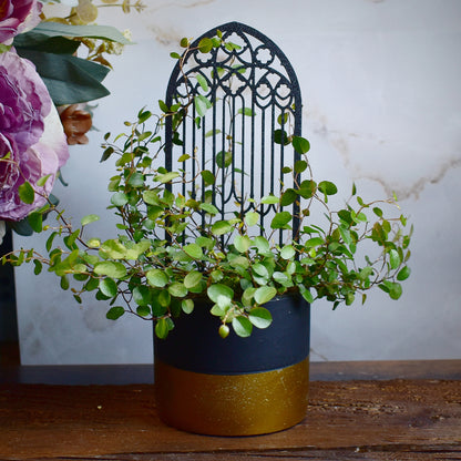 ornamental plant stake inspired by gothic cathedral windows